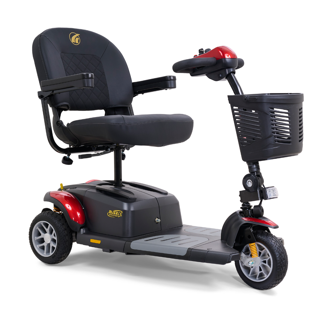 The Golden Tech GB118 Buzzaround EX Portable Mobility Scooter is a black and red, three-wheel mobility solution with a cushioned seat, handlebars, foldable armrests, and a front basket, offering sturdy support for those needing mobility assistance.