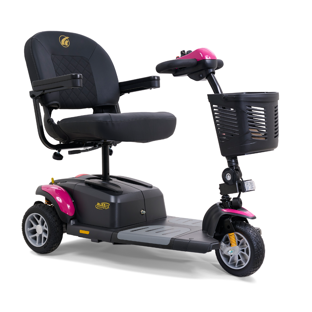 The Golden Tech GB118 Buzzaround EX is a stylish black and pink three-wheel mobility scooter with a cushioned seat, armrests, control panel with handlebars, and front basket. Designed for personal transport, it offers a stable base and compact size for easy maneuverability.