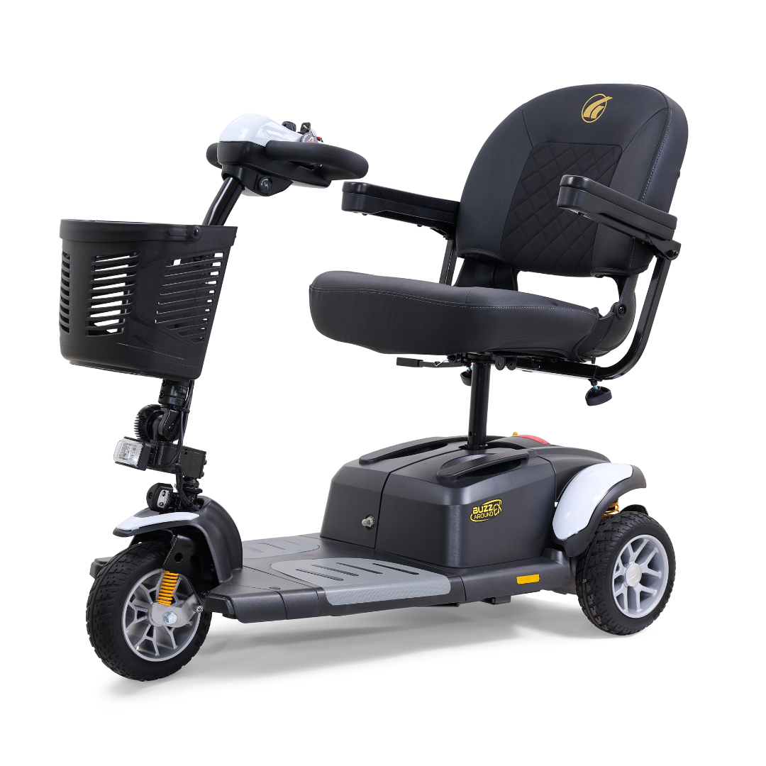 The Golden Tech GB118 Buzzaround EX Portable Mobility Scooter has a black seat, armrests, and three wheels. Featuring a front basket, handlebar controls, and low footrest, this compact scooter offers practical maneuverability for easy use.