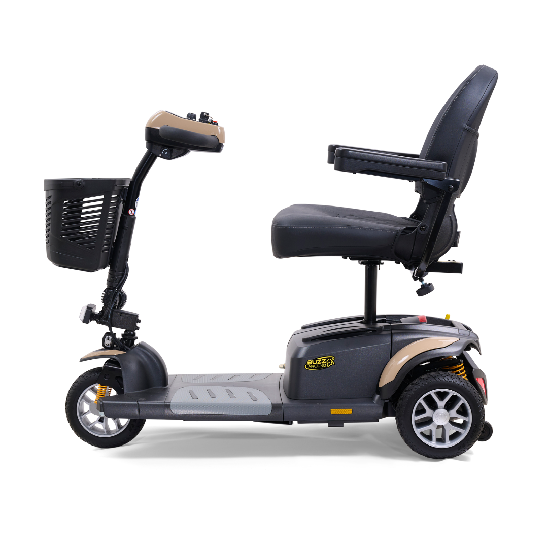 Side view of the Golden Tech GB118 Buzzaround EX Portable Mobility Scooter, featuring a cushioned seat, armrests, handlebar, and front basket on this lightweight three-wheeled scooter against a white background.