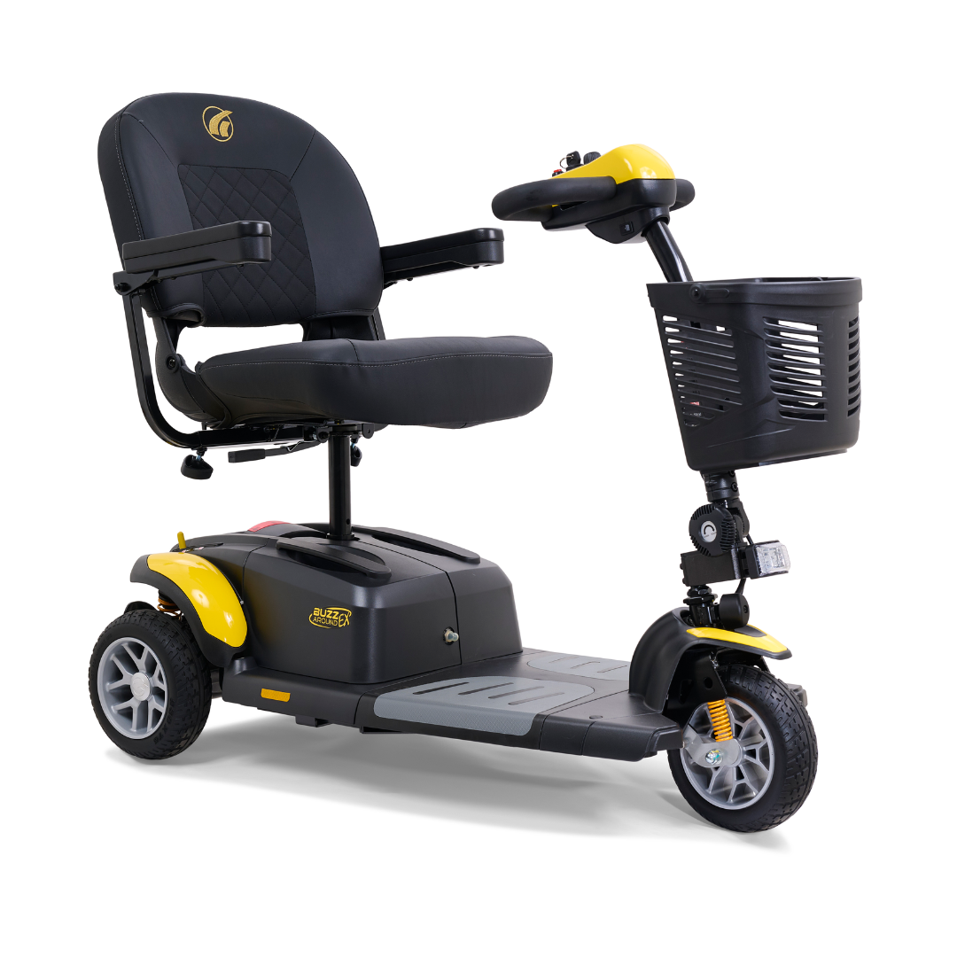 The Golden Tech GB118 Buzzaround EX Portable Mobility Scooter features three wheels, a black seat with armrests, yellow accents, and a front basket. This stylish scooter boasts a modern design, sturdy base, and small wheels for both indoor and outdoor mobility.