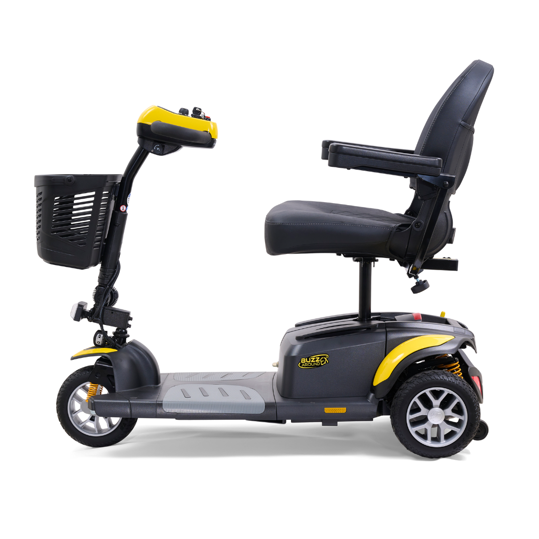 The Golden Tech GB118 Buzzaround EX Portable Mobility Scooter is a three-wheeled, lightweight scooter in yellow and black. It features a padded seat with armrests, front basket, and handlebars with controls for easy maneuverability and comfort.