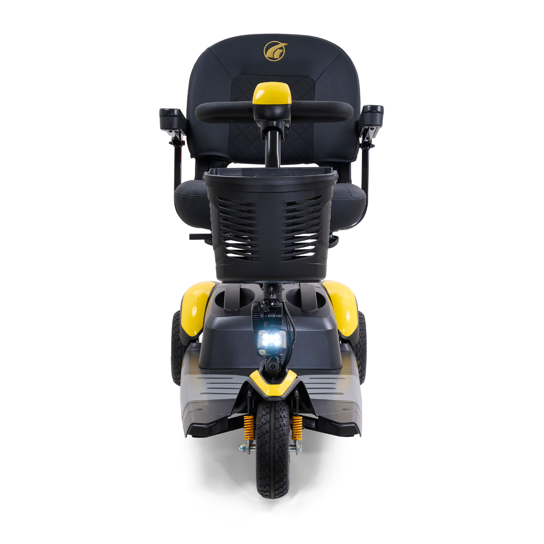 Front view of a Yellow and Black Golden Tech GB118 Buzzaround EX Portable Mobility Scooter. This lightweight scooter includes a padded seat, steering handle with basket, and single front wheel with headlight for convenience and style.