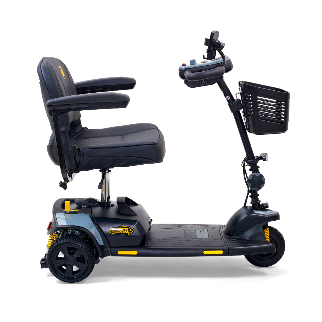 The Golden Tech GB121 Buzzaround XLS HD is a black 3-wheel portable scooter with armrests, handlebars, a front basket, and reflective yellow accents. It features Comfort Spring Suspension for smooth rides. Designed for accessibility and ease of transportation.