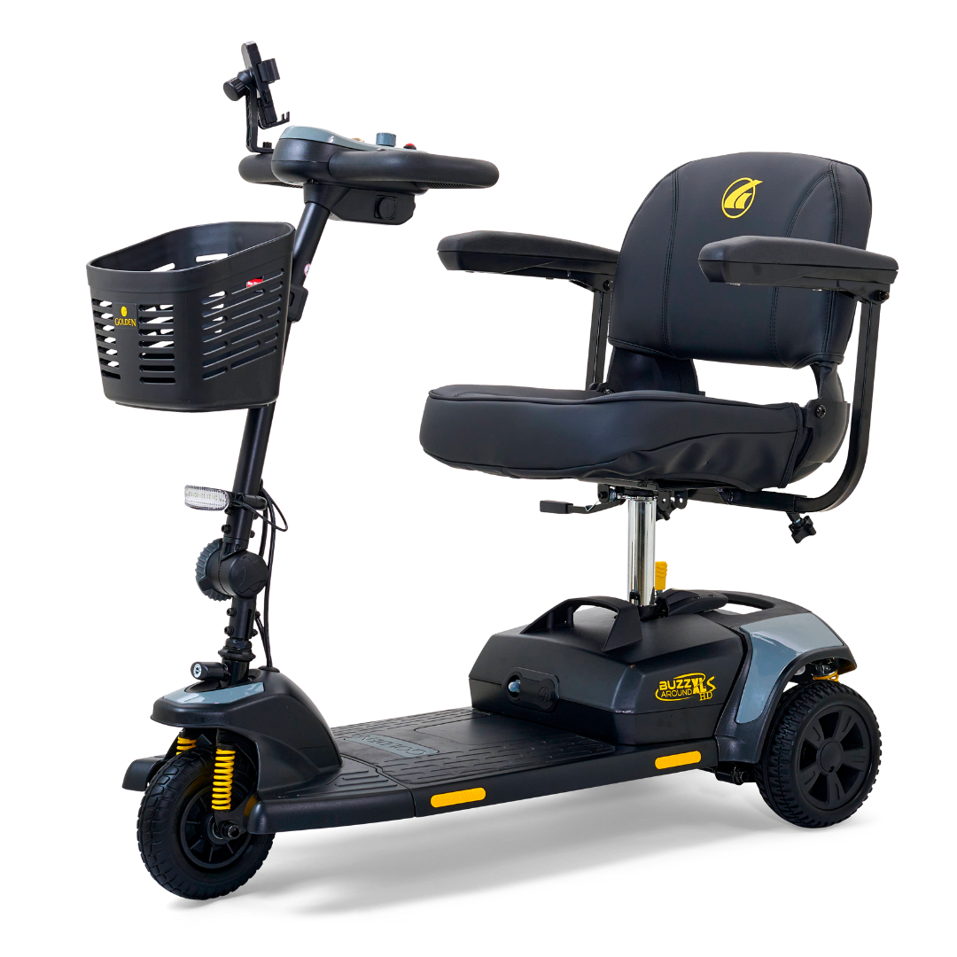 The Golden Tech GB121 Buzzaround XLS HD 3-Wheel Portable Scooter in black offers a padded seat and armrests for comfort. It features a front basket, handlebars with controls, and Comfort Spring Suspension for smooth rides. The yellow brand logo adorns both the body and seat.
