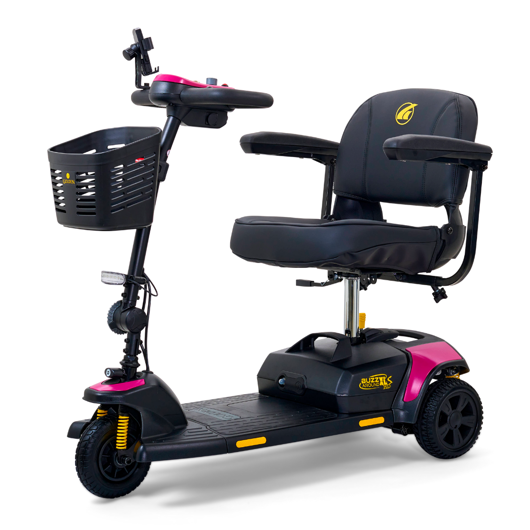 The Golden Tech GB121 Buzzaround XLS HD 3-Wheel Portable Scooter offers a sleek design with a black seat, armrests, and front basket. It includes pink accents and Comfort Spring Suspension for seamless transportation.