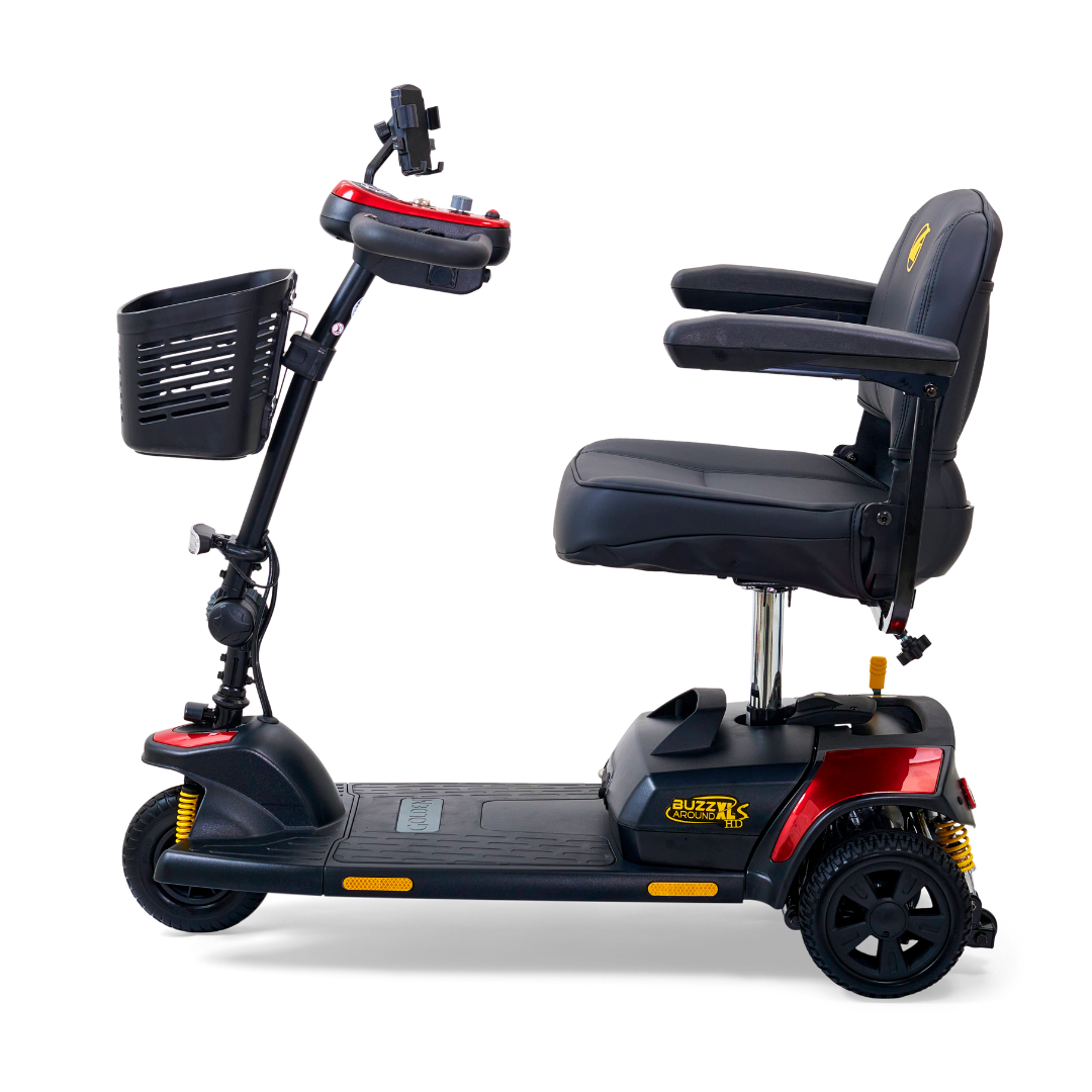 The Golden Tech GB121 Buzzaround XLS HD is a black and red 3-wheel portable scooter featuring a Delta tiller, front basket, padded seat, armrests, and control panel with phone holder. It includes an XR Extended Range Battery for long rides and offers easy transport and maneuverability.