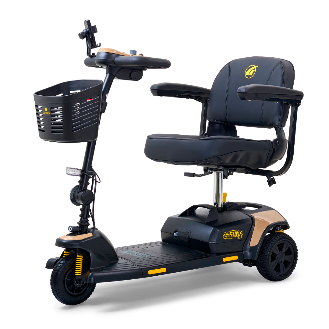 The Golden Tech GB121 Buzzaround XLS HD is a compact, three-wheeled black scooter with gold accents. It features a stadium-style seat with armrests, Delta tiller for easy steering, rear wheels, and a front handlebar basket, ideal for enhanced mobility support.