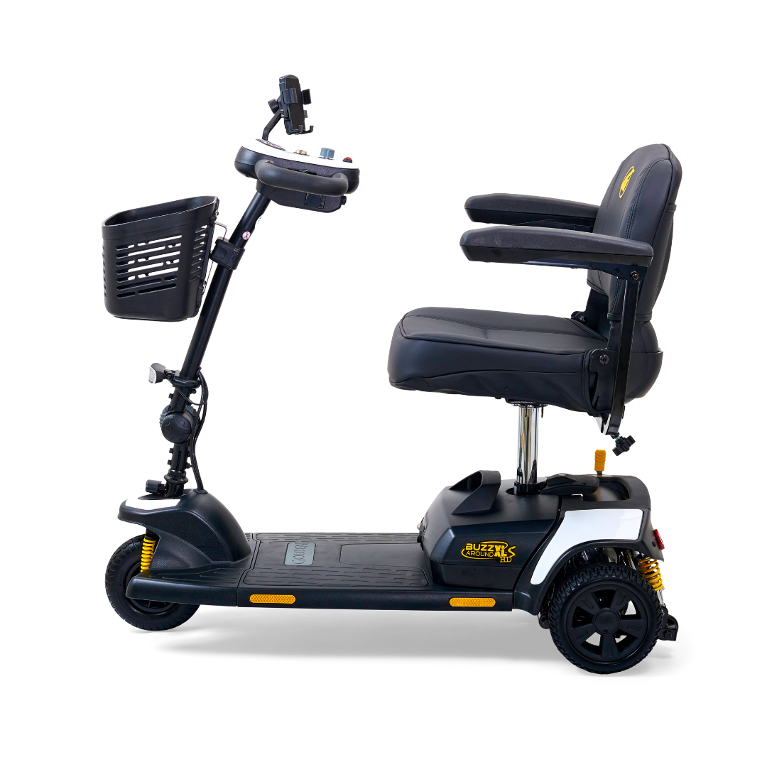 The Golden Tech GB121 Buzzaround XLS HD is a sleek, black 3-wheel portable scooter with Comfort Spring Suspension, a stadium-style seat with cushioned armrests, Delta tiller control panel, LED lights, reflective side accents, and a small front basket.