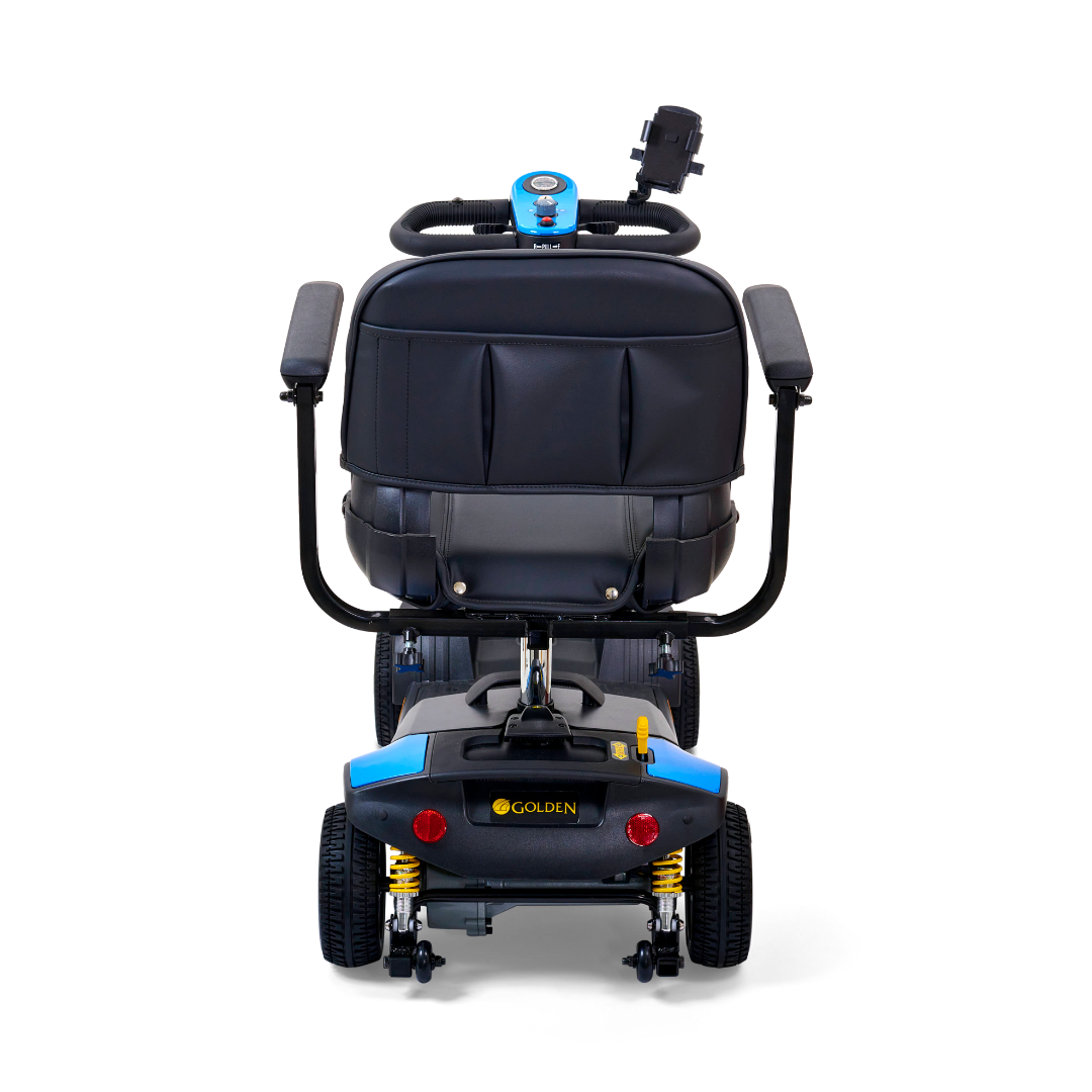 Rear view of a blue Golden Tech GB124 Buzzaround XLS HD 4-wheel scooter with black seating and handlebars featuring a Delta tiller. It includes an XR Extended Range Battery for longer rides, and the control panel is visible on the handlebars.