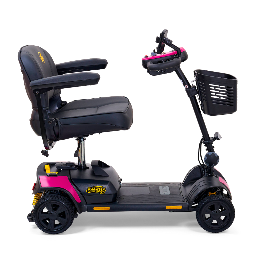 The Golden Tech GB124 Buzzaround XLS HD 4-Wheel Scooter, in black and pink, features an XR Extended Range Battery, a padded seat with armrests, handlebar controls, and a front basket. With its compact design and suspension, its perfect for personal transportation.