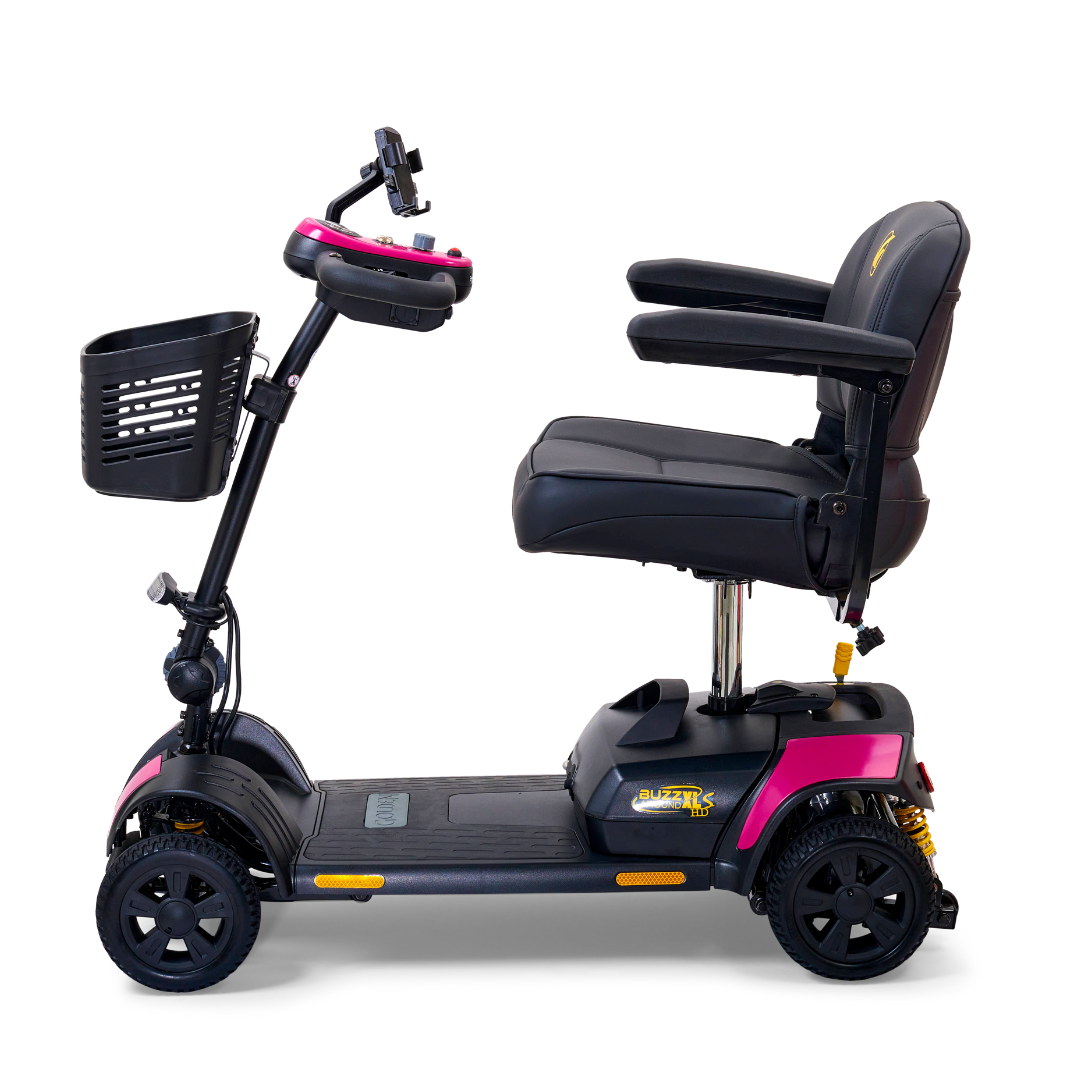 The Golden Tech GB124 Buzzaround XLS HD is a sleek, black 4-wheel mobility scooter featuring pink accents, a delta tiller, padded seat with armrests, a handlebar basket, front headlights, and Comfort Spring Suspension for a smoother ride.