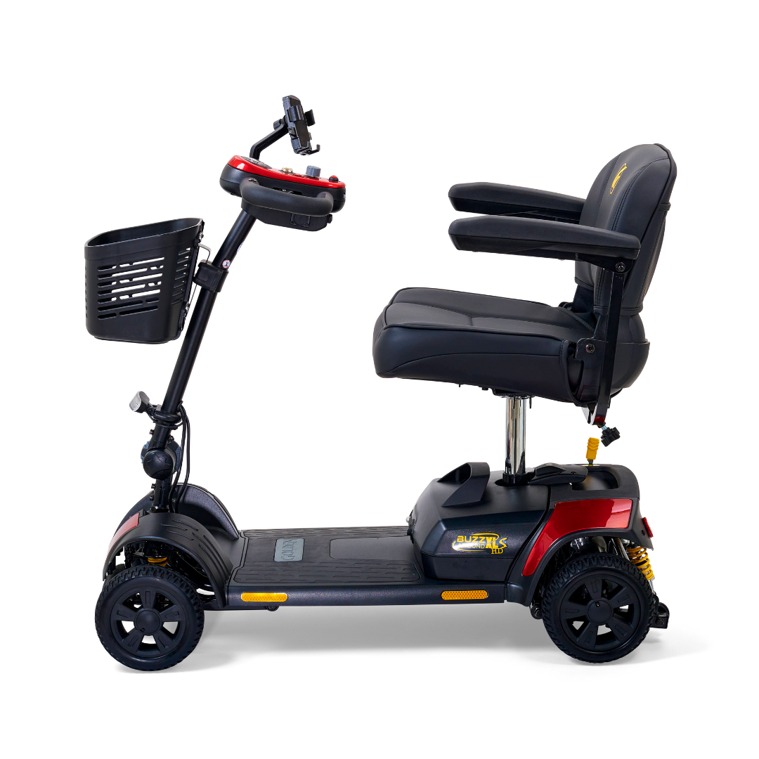 The Golden Tech GB124 Buzzaround XLS HD is a red 4-wheel portable scooter featuring a Delta tiller, adjustable black seat with armrests, handlebars, front basket, and Comfort Spring Suspension for enhanced ride stability.