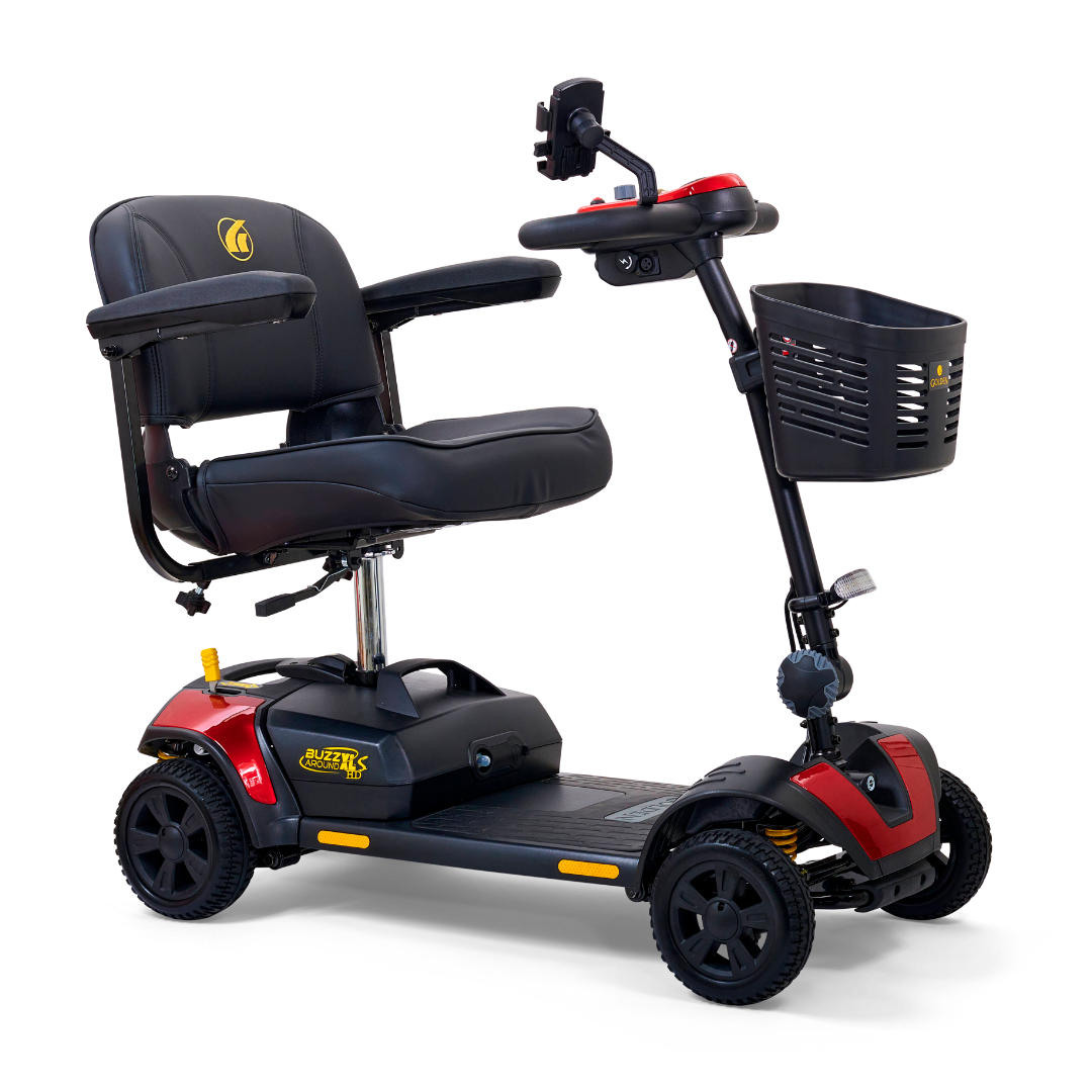 The Golden Tech GB124 Buzzaround XLS HD is a portable 4-wheel scooter with a black cushioned seat, armrests, and striking red sides. It features a front black basket and Delta tiller handlebar controls. The Comfort Spring Suspension ensures smooth rides.