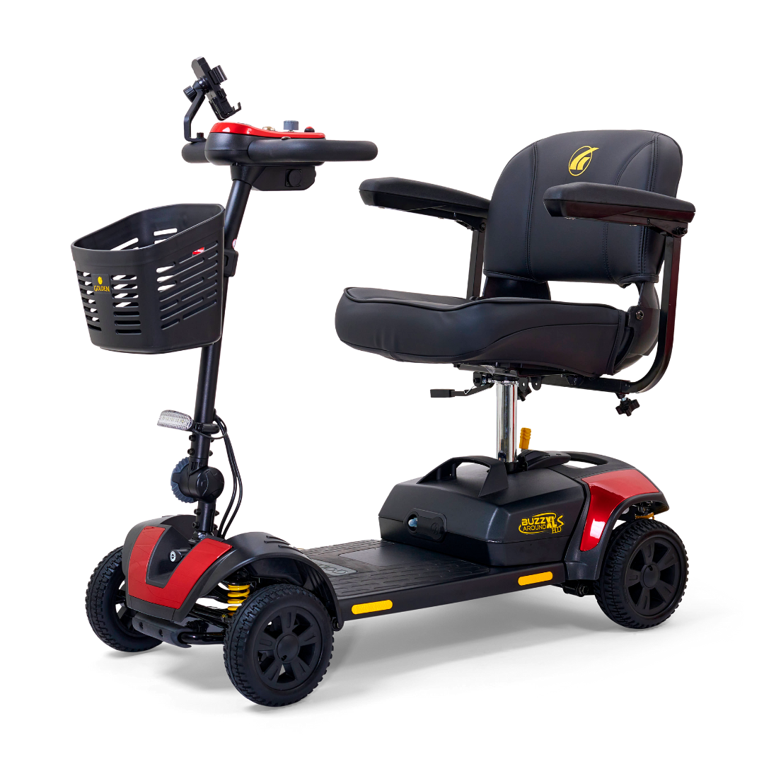 The Golden Tech GB124 Buzzaround XLS HD 4-Wheel Portable Scooter, in red, has a black seat and armrests, a Delta tiller for easy use, front basket, compact design for all terrains, and Comfort Spring Suspension for smooth rides.