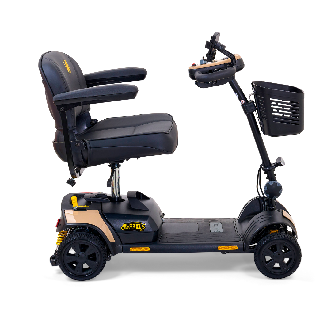 The Golden Tech GB124 Buzzaround XLS HD is a 4-wheel portable scooter with a delta tiller, cushioned seat, armrests, basket, yellow-accented black design, handlebar control, Comfort Spring Suspension for smooth rides, and rear reflector lights.
