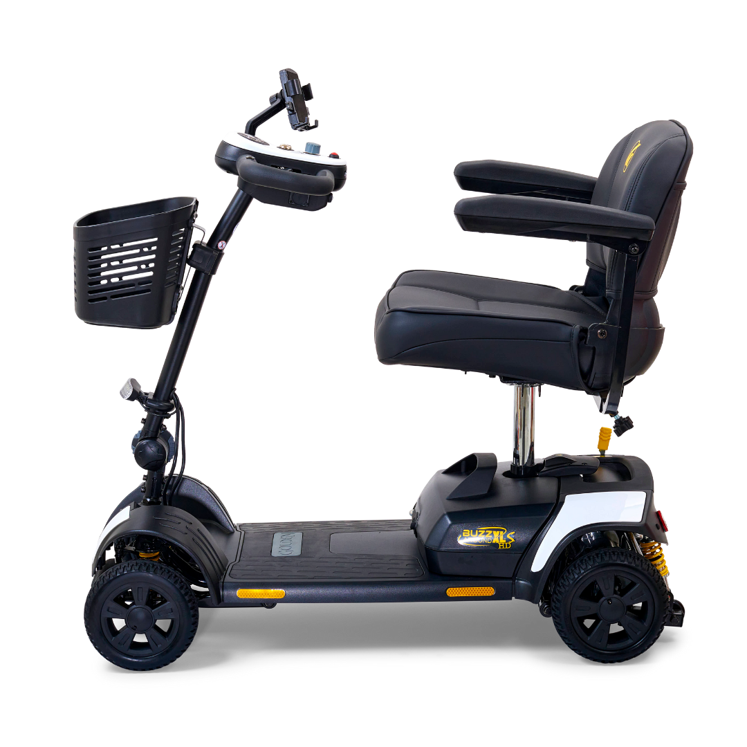 Side view of the Golden Tech GB124 Buzzaround XLS HD 4-Wheel Portable Scooter, featuring a black design with a cushioned seat, armrests, front basket, digital control panel on the handlebars, and Comfort Spring Suspension for smoother rides.