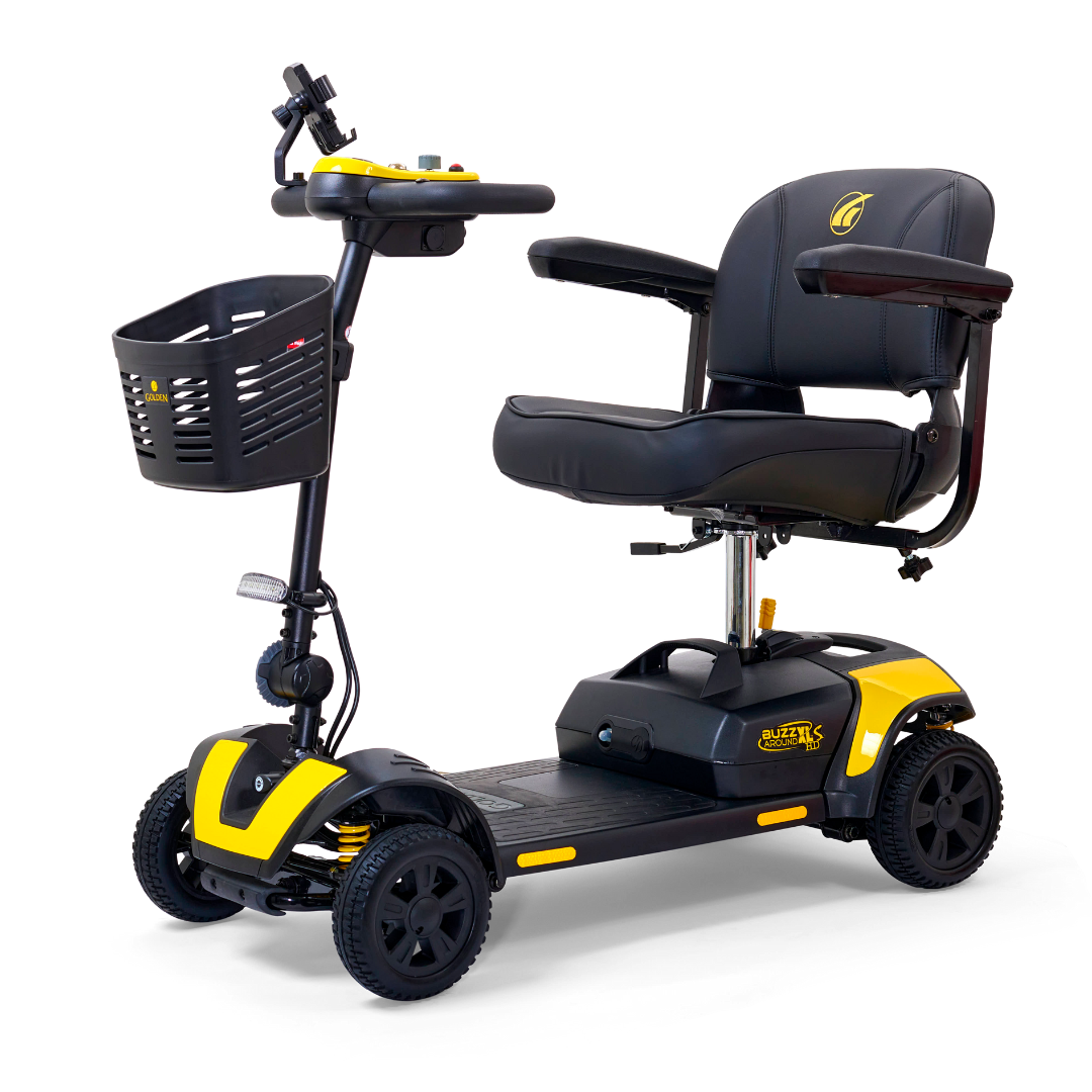 The Golden Tech GB124 Buzzaround XLS HD is a black and yellow mobility scooter featuring Comfort Spring Suspension, a front basket, handlebars, cushioned seat, ergonomic delta tiller, and four wheels for ease of use in a compact and modern design.