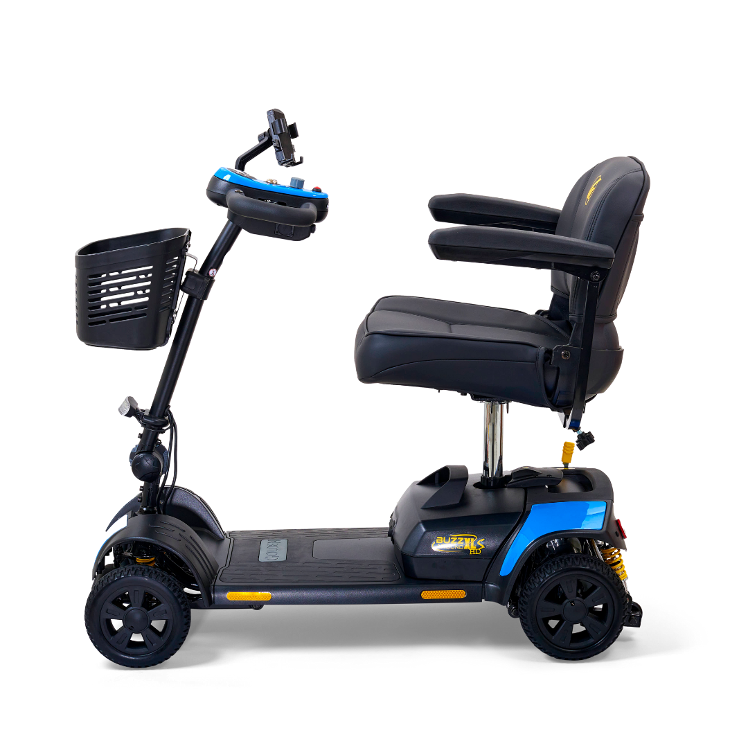 Side view of the Golden Tech GB124 Buzzaround XLS HD scooter, showcasing its blue and black design. It features Comfort Spring Suspension, padded seat with armrests, controls on the handlebar, a Delta tiller for easy steering, and a front-mounted basket.