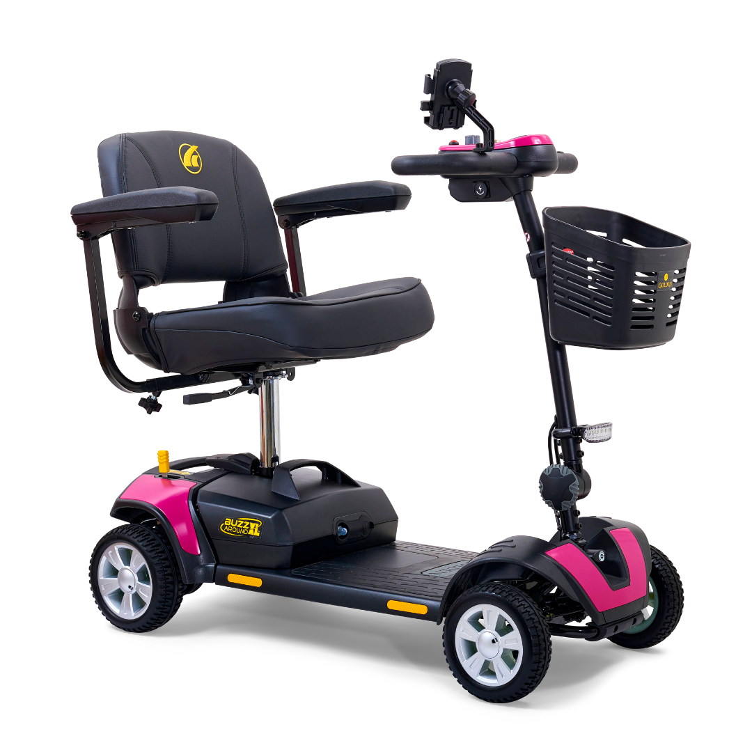 Introducing the Golden Tech GB124 Buzzaround XL, a stylish four-wheel portable scooter with pink and black accents. It offers an increased range, better maneuverability, cushioned seat with armrests, a front basket, and control panel handlebar atop small durable wheels for indoor/outdoor use.