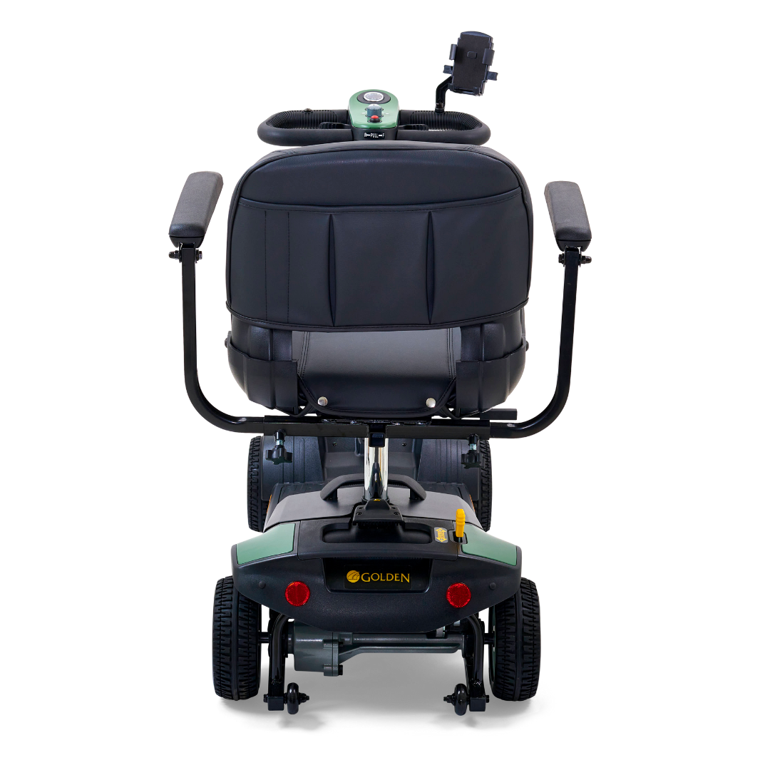A rear view of the Golden Tech GB124 Buzzaround XL shows a mobility scooter with a black seat and armrests, four-wheel design for enhanced maneuverability, tiller for steering, Golden label on the back, small control panel above the seat, and an extended range battery.