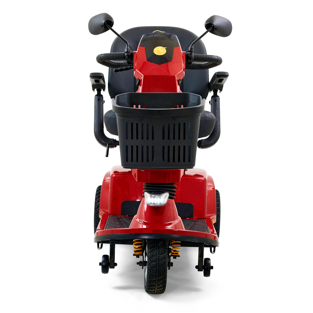 The Golden Tech GC340 Companion Full-Size Bariatric Mobility Scooter, in red, comes with a black front basket, side mirrors, and a cushioned high-back stadium-style seat. It features handlebars, an adjustable tiller for comfort, and a headlight below the basket for better visibility.
