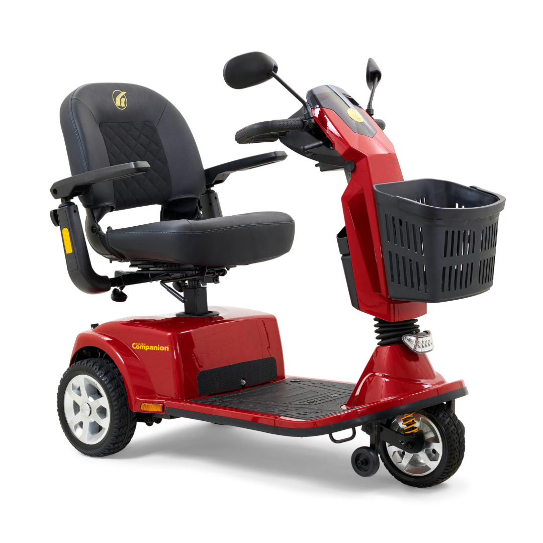 The Golden Tech GC340 Companion Full-Size Bariatric Mobility Scooter features a red frame, black cushioned high-back stadium-style seat with armrests, adjustable tiller, front basket, small headlight, and anti-tip wheels for enhanced safety—ideal for comfort and convenience.