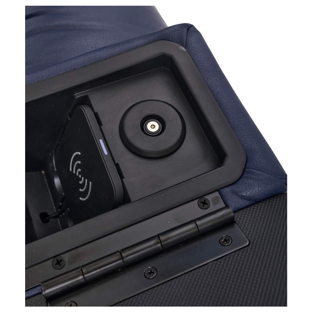 Close-up of the built-in charging compartment on the Golden Tech PR525 Cloud+ Recliner With Lift Assist & Twilight - SM, featuring a wireless charging pad, round charging port, and black hinge on the open lid.
