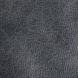 Close-up of the dark gray textured surface resembling leather with intricate patterns and fine lines, as featured in the sleek design of the Golden Tech PR766 Relaxer MaxiComfort Recliner With Lift Assist - Small.