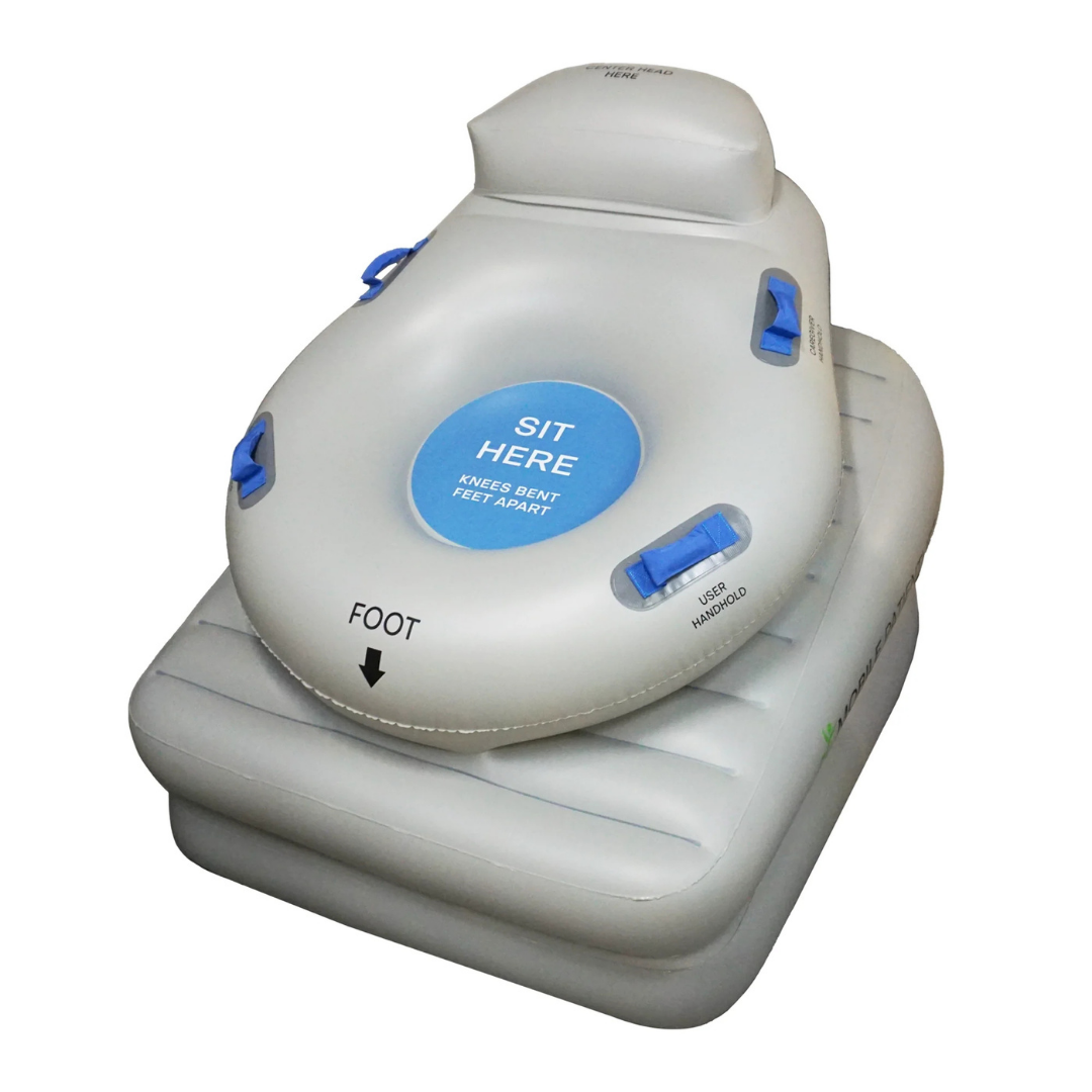 The HelpUp Fall Recovery Patient Lift is a safe, portable floor lift assist device with Airlift Technology, a backrest, handles, and an inflatable square base. The seat shows “SIT HERE KNEES BENT FEET APART” with a “FOOT” arrow.