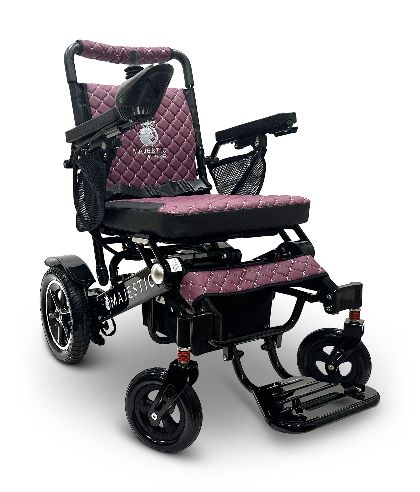 The MAJESTIC IQ-7000 Remote Controlled Electric Wheelchair boasts a black frame with a quilted burgundy seat and backrest. It includes armrests, a joystick controller, footrests, and robust wheels that ensure travel mobility and comfort.