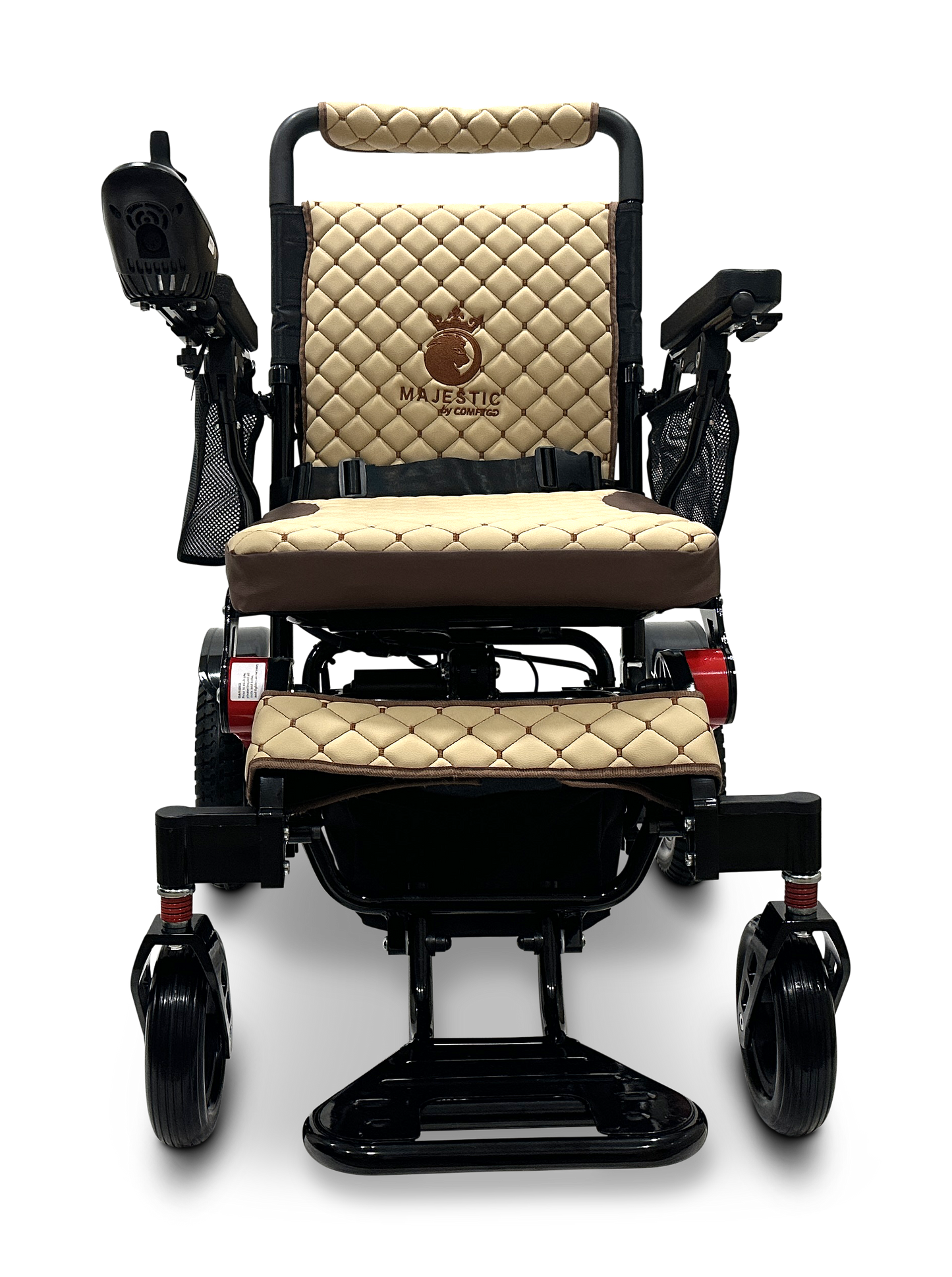 Discover the sophistication of the MAJESTIC IQ-7000 Remote Controlled Electric Wheelchair, featuring a luxurious beige and black design with quilted upholstery and armrests. The backrest highlights an embroidered "Majestic" emblem, while the lightweight model includes an intelligent joystick on the right armrest and a convenient footrest below.