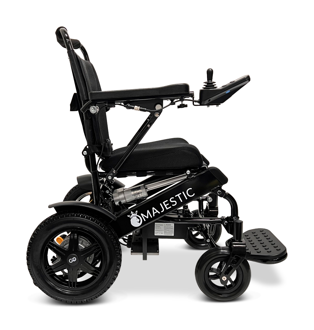 The ComfyGo MAJESTIC IQ-9000 Auto Reclining Electric Wheelchair in black features a side view, cushioned seat, digital joystick control, large rear and small front wheels, aircraft-grade aluminum alloy frame, and MAJESTIC branding.