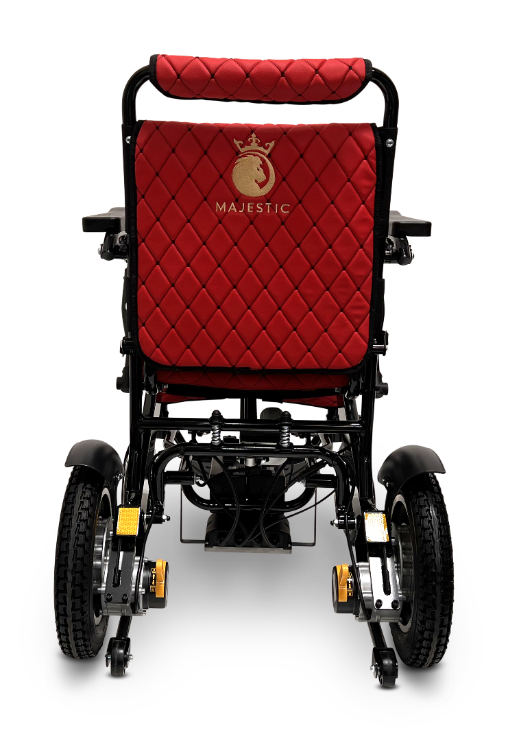 Rear view of a black ComfyGo MAJESTIC IQ-9000 Auto Reclining Electric Wheelchair with quilted red upholstery, gold Majestic logo on the backrest, large rear wheels, brushless silent motors, and sturdy armrests.