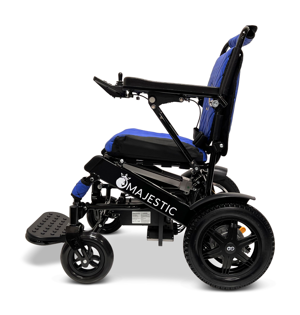 Side view of the ComfyGo MAJESTIC IQ-9000 Auto Reclining Electric Wheelchair, a lightweight, foldable model with a black frame, blue seat and backrest, large rear wheels, footrest, and aircraft-grade aluminum alloy construction.