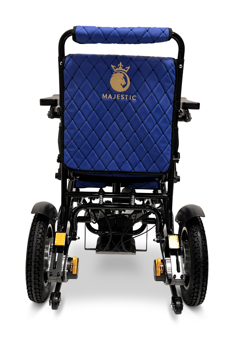 Rear view of a blue ComfyGo MAJESTIC IQ-9000 Auto Reclining Electric Wheelchair with quilted stitching, gold logo on the backrest, large rubber wheels, visible footrests and armrests, made from aircraft-grade aluminum alloy.