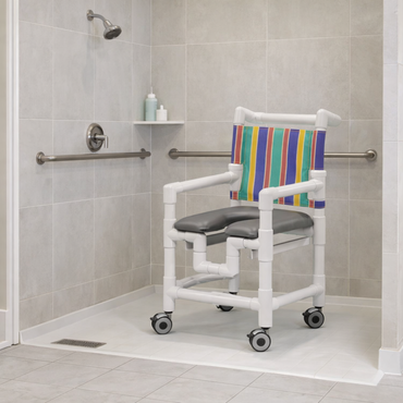 A shower with grab bars and a shelf for toiletries features the IPU Pediatric/Youth PVC Rolling Shower Chair Commode, which has wheels, a padded seat, and a colorful striped backrest—see the specifications table for more details.