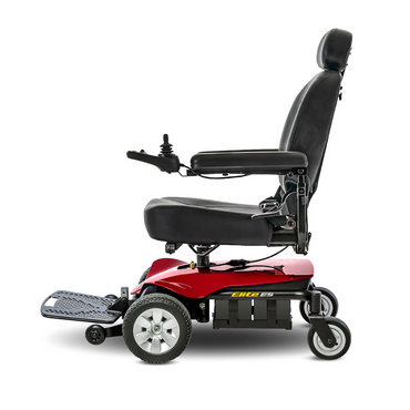 A Pride Mobility Jazzy® Elite ES Powerchair in red and black, featuring a high-back seat, armrests, footrest, and right-arm joystick control, is shown from the side against a white background.
