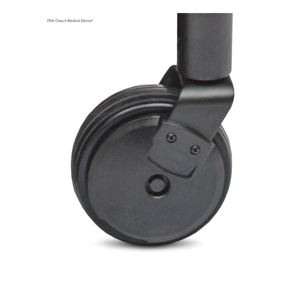 Close-up of a black caster wheel with Mid-Wheel 6® technology on the Pride Mobility Jazzy® 600 ES Powerchair’s leg, showcasing a smooth design and visible bolts. Text reads, “FDA Class II Medical Device.” Renowned for superior maneuverability.