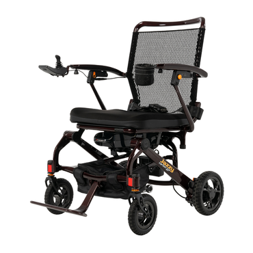 The Jazzy® Carbon 27 Ultralite Portable Power Wheelchair is an ultra-light, foldable chair with a mesh backrest, padded seat, footrest, right-arm joystick control, four wheels, and a sleek modern design for easy mobility.