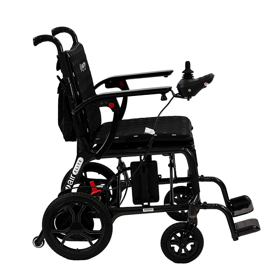 The Journey Air Elite Folding Carbon Fiber Powerchair, weighing just 29 lbs, is a sleek black model with a right-armrest joystick control. It features footrests, a smooth suspension system, travel-friendly design, visible wiring, and an accessible control panel near the joystick.