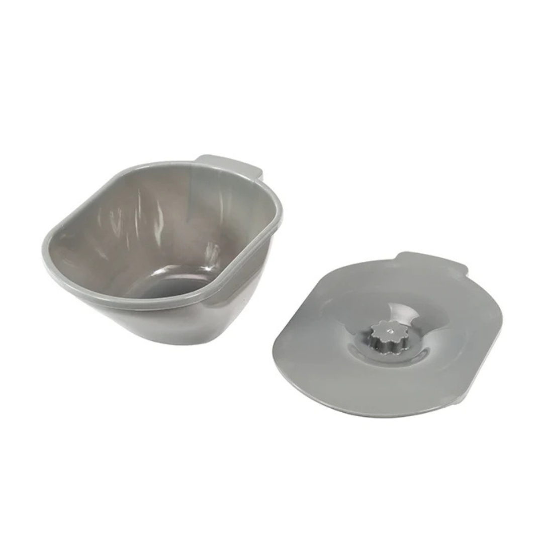 The Journey SoftSecure Uplift Toilet Assist Commode includes a gray plastic bowl with a lid featuring a central flower-shaped opening and small handle tabs—ideal for use with lift-assist commodes or 3-in-1 bathroom chairs.