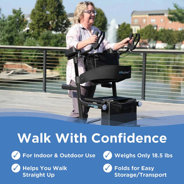 A smiling woman uses the Journey UPWalker Premium Lite Upright Rolling Walker - Dark Silver on a sunny boardwalk. Text highlights it’s for indoor/outdoor use, promotes upright walking, weighs 18.5 lbs, and folds for easy storage.