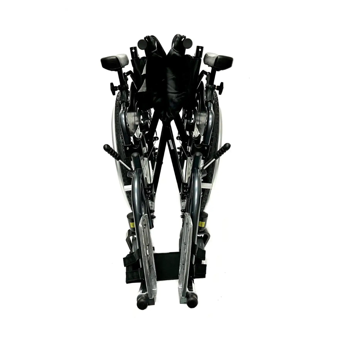 The Karman KM-8520X Bariatric Wheelchair – Lightweight Heavy Duty is shown upright on a white background, highlighting its wheels and footrests.