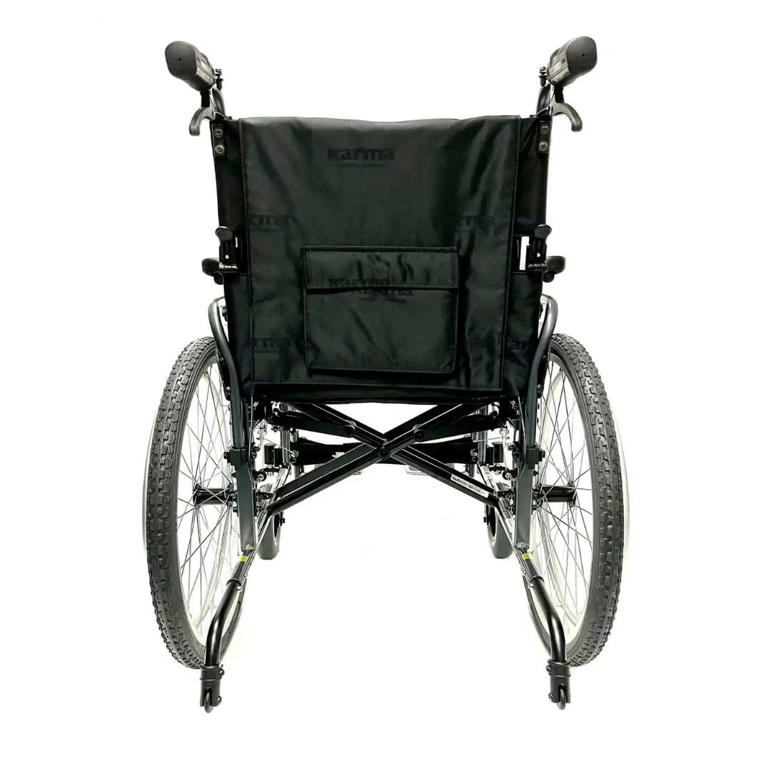 A rear view of the Karman KM-8520X Bariatric Wheelchair – Lightweight Heavy Duty, featuring large rear wheels, hand rims, and a fabric backrest. The black folding wheelchair is set against a white background.