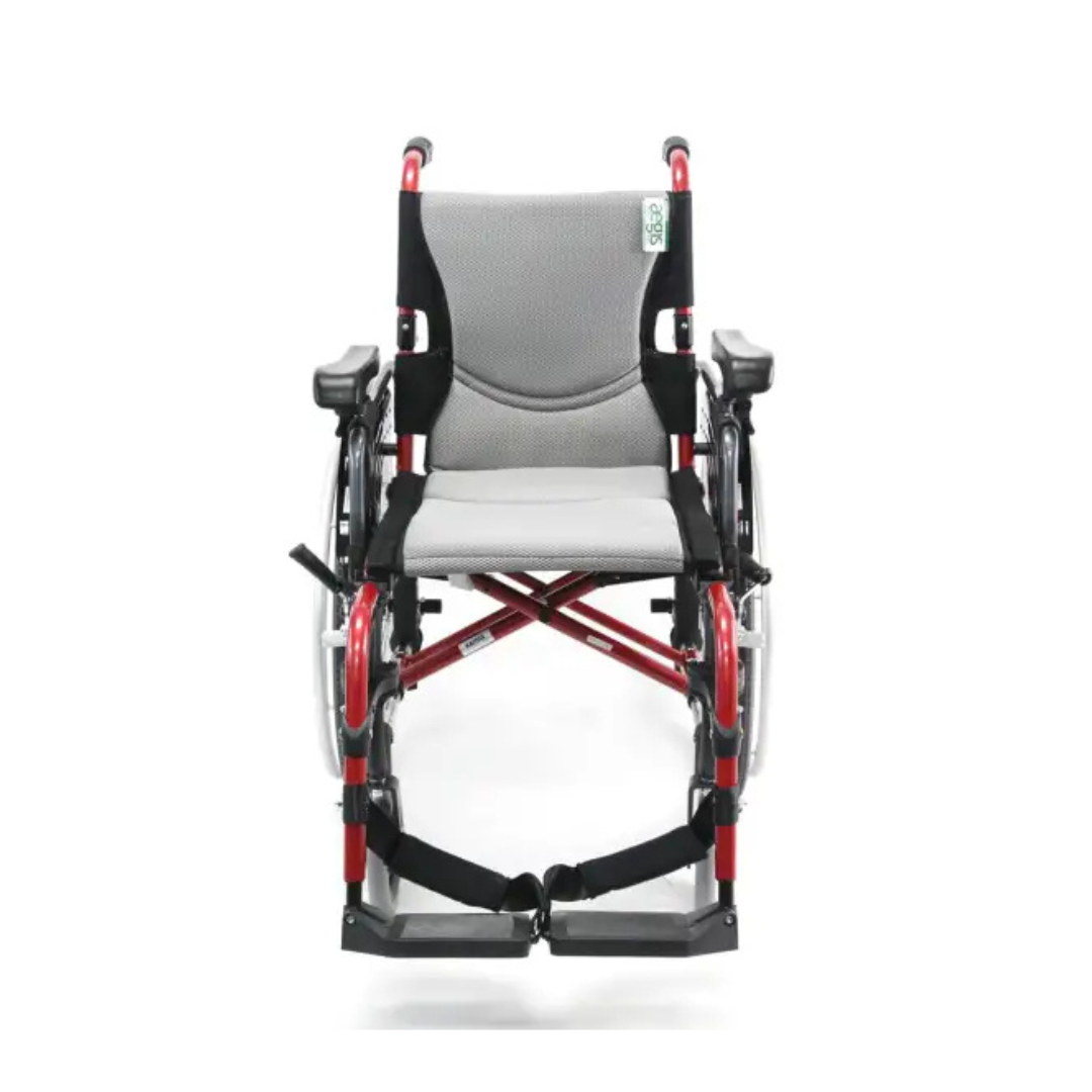 Discover the Karman S-Ergo 305 Ultra Lightweight Ergonomic Wheelchair with adjustable seat height, featuring a red and black X frame, detachable footrests, and a grey fabric seat and backrest for superior long-term comfort.