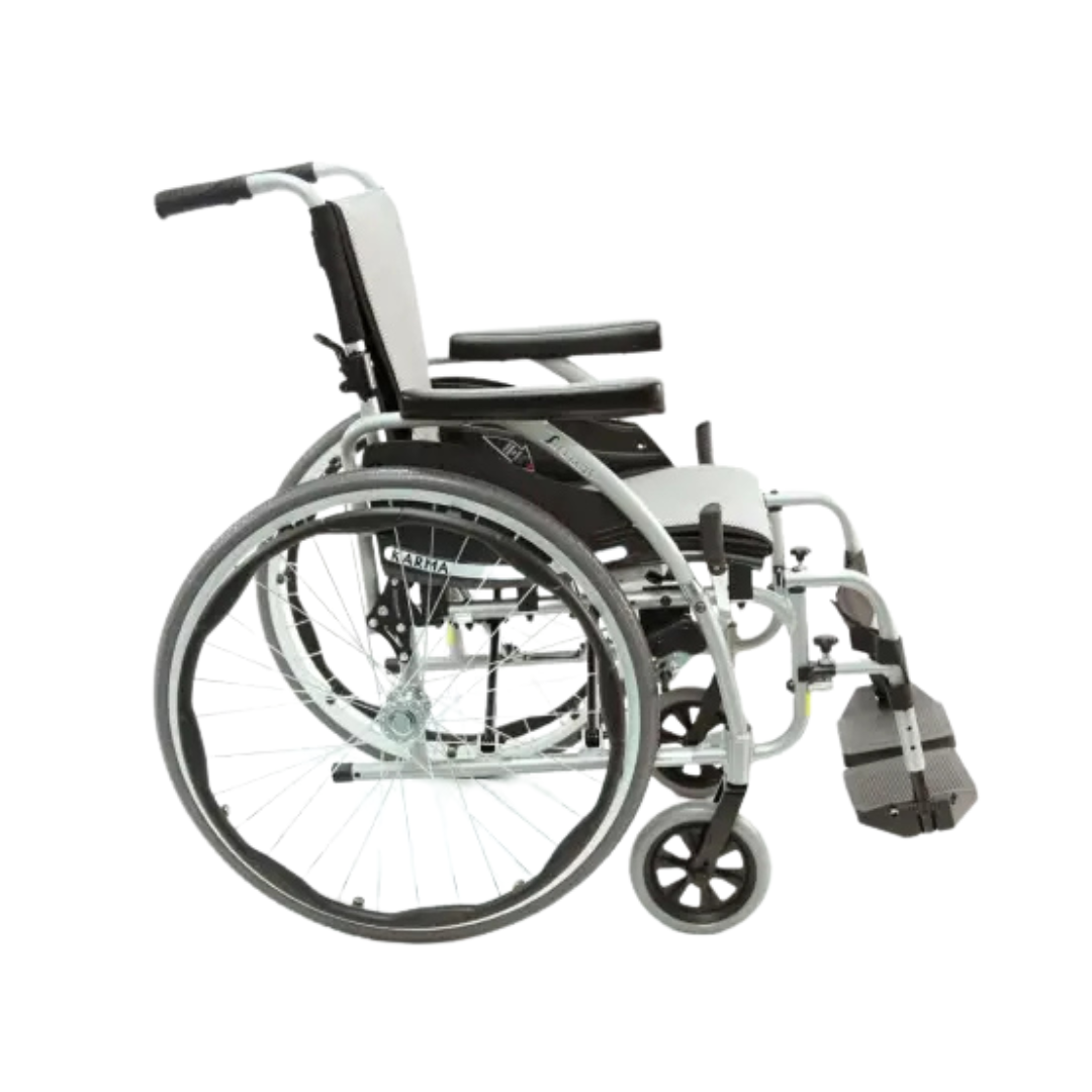 The Karman S-Ergo 125 is an ultra-lightweight silver manual wheelchair with black accents, offering ergonomic seating with cushioned seat, armrests, and footrest. It ensures pressure relief and support, featuring large rear wheels and smaller front wheels for enhanced mobility.