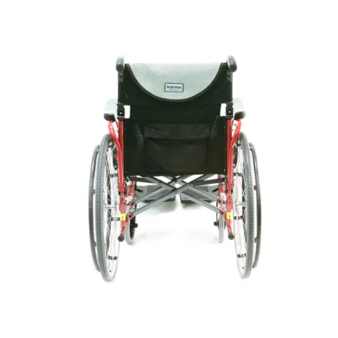 The Karman S-Ergo 125 Ergonomic Lightweight Wheelchair showcases a black fabric seat, stylish red frame, large rear and smaller front wheels, and a handy storage pocket on the backrest.