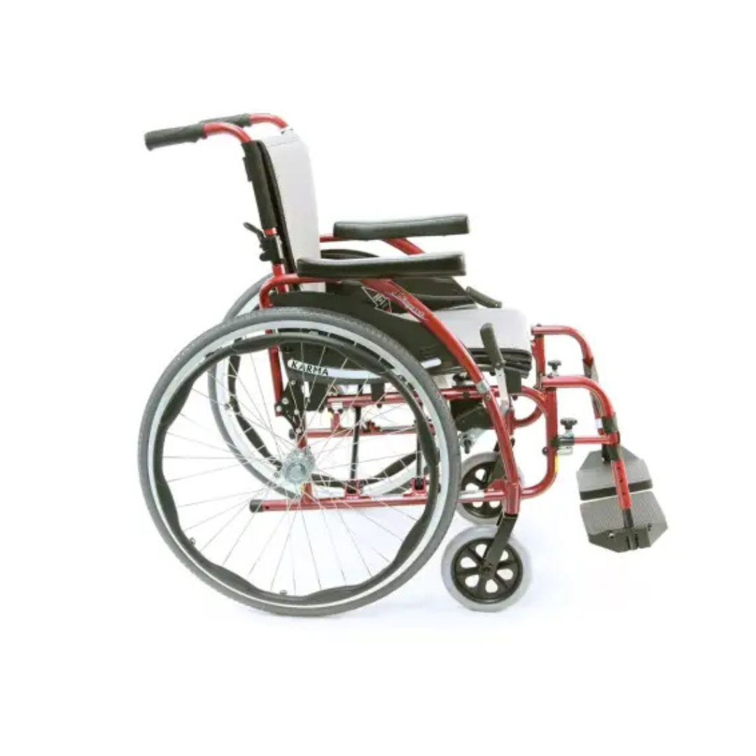 The Karman S-Ergo 125 Ergonomic Lightweight Wheelchair in red and black features large rear wheels, smaller front casters, adjustable flip-back arms, ergonomic seating for pressure relief, and footrests that enhance mobility and ease of use.