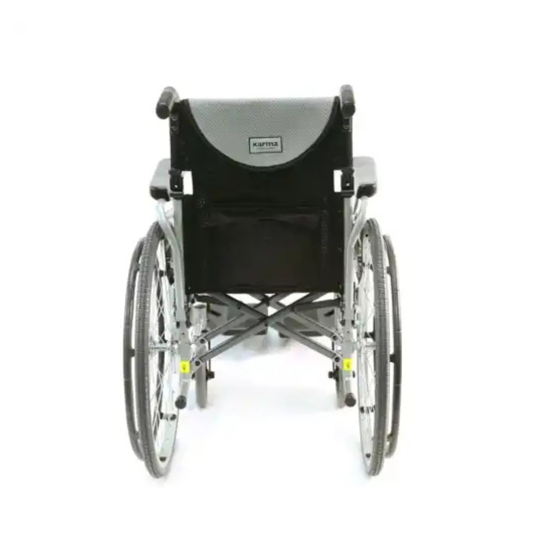 A rear view of the Karman S-Ergo 125 Ergonomic Lightweight Wheelchair with gray and black upholstery highlights its ergonomic seating. Featuring large rear wheels and smaller front ones, Karma is visible on the backrest, ensuring comfort and mobility.